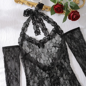 Flat lay of sheer black floral lace bodysuit with matching sleeves and rose decor
