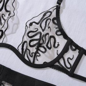 Detail of snake pattern embroidery on translucent white mesh sexy lingerie top