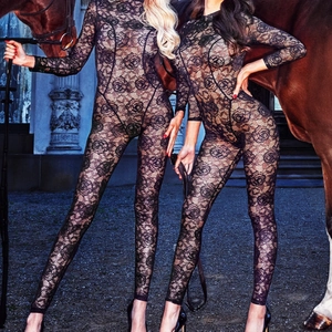 Detail of black floral lace bodysuit showing intricate rose patterns and mesh texture