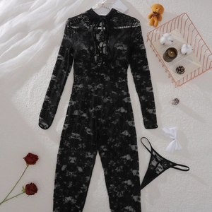 Detailed view of the black floral lace texture on the long-sleeve bodysuit and thong set