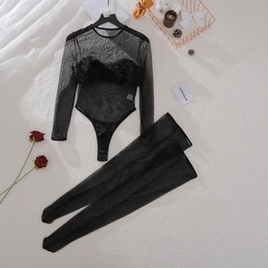 Close-up of black mesh bodysuit set featuring intricate 3D floral appliqués and stockings