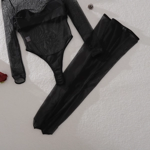 Flat lay of black sheer mesh bodysuit set with long sleeves and matching leggings