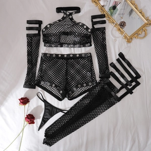 Detail of black fishnet lingerie set with metal eyelets and halter neck top on white linen