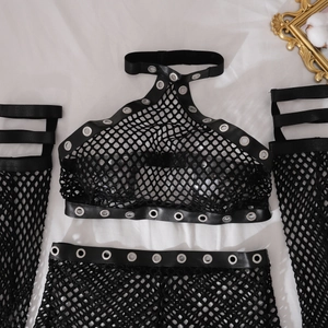 Detailed view of black fishnet lingerie set with metal grommets and faux leather trim