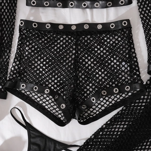 Close-up of black fishnet lingerie set with faux leather trim and silver metal eyelets