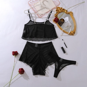 Black sheer mesh lingerie set with sparkling rhinestone straps shown in a French flat lay