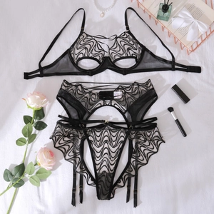 Three-piece black lace lingerie set with sheer embroidery and adjustable straps