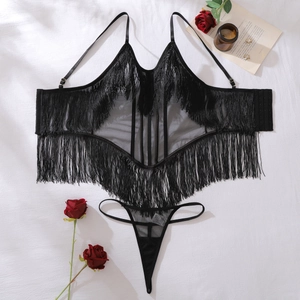 Flat lay of sexy black mesh lingerie set with long fringes and rose petals