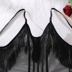 Close-up of black mesh lingerie top featuring dense long tassels and slim shoulder straps