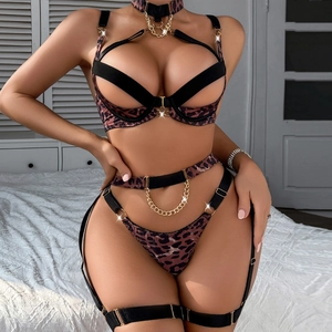 Detail of leopard print lingerie with gold metal chains and hollow-out strappy design