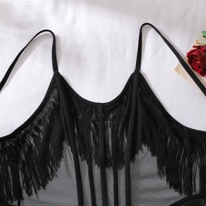 Detailed macro view of black mesh sheer bodysuit with fringe tassels and boning structure