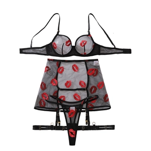 Three-piece black sheer mesh lingerie set featuring red lip embroidery and garters