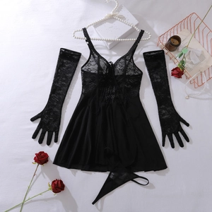 Flat lay of black floral lace bodysuit with matching long gloves and pearl accents
