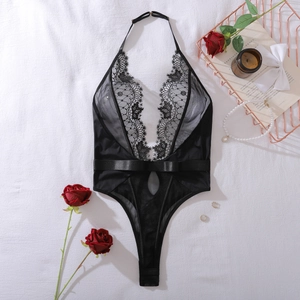 Detail of black floral lace embroidery and sheer mesh on a sexy halter bodysuit