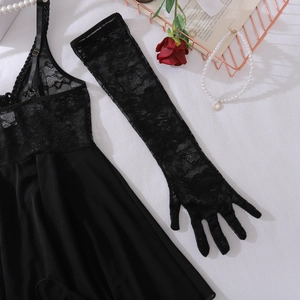Detailed view of sexy black lace bodysuit with matching glove and elegant accessories