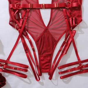 Detailed macro view of red sheer mesh bodysuit with silk straps and gold rings