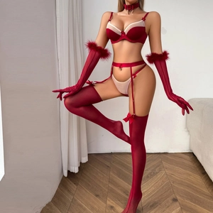 Red bow lingerie set with sheer stockings, faux fur trim gloves and choker on a model