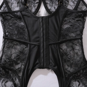 Close-up of black floral lace bodysuit showing back hook-and-eye closure and mesh panels