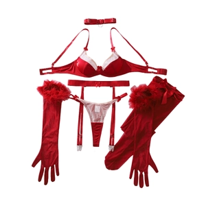 Red bow lingerie set with sheer stockings, faux fur trim gloves and choker on white background