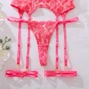 Detail showing pink heart lace garter belt and thong with adjustable metal buckles