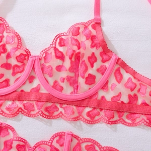 Detail of pink lace bra with leopard embroidery and underwire support design