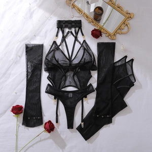 Detail of black sheer mesh lingerie set with golden buckles and floral lace accents