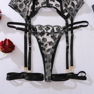 Detailed view of leopard print sheer lace lingerie set with metal adjustment buckles