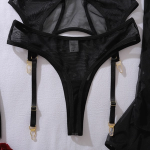 Detail of black mesh lace lingerie with garter belt and gold metal adjustment buckles