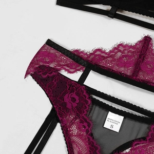 Detail of floral lace trim and mesh fabric on sexy lingerie set with size S wash label
