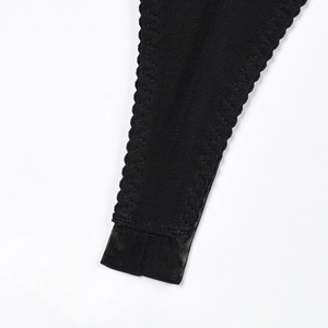 Detail of black mesh fabric lingerie with reinforced stitching and zigzag edge finish