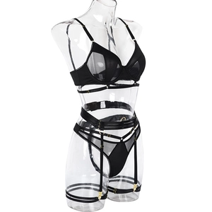 Detail view of black mesh lingerie set featuring gold rings and adjustable straps