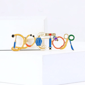 Vintage medical DOCTOR brooch pin with stethoscope and syringe motifs in colorful enamel