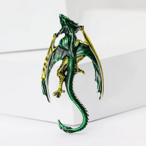 Elegant green enamel dragon brooch with silver plating on white geometric pedestals