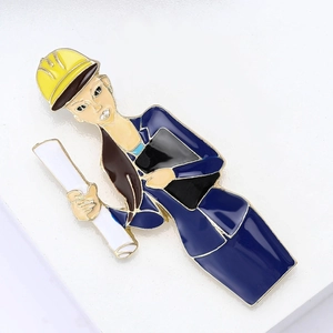Creative female engineer enamel brooch featuring yellow hard hat and design drawings