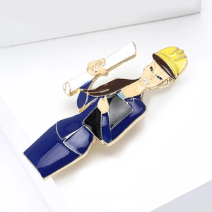 Creative female engineer brooch pin with yellow hard hat and blueprints in golden finish