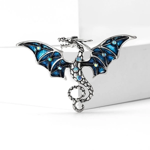 Élégante broche dragon en argent avec ailes en émail bleu et strass colorés
