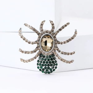 Macro detail of high-end vintage spider brooch with champagne crystal and rhinestones