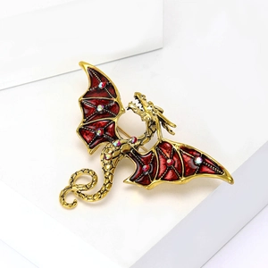 Détails de la broche dragon avec ailes en émail rouge et strass brillants sur métal
