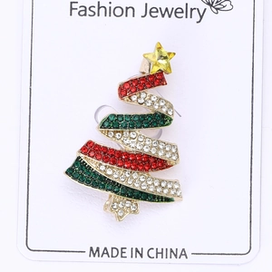 Detailed view of alloy Christmas tree brooch with colorful rhinestones and gold star