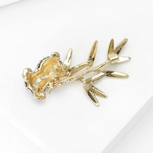 Chinese style golden bamboo brooch with panda head and sparkling dark crystal inlay