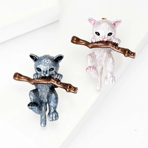 Cute enamel alloy cat brooches in grey and white colors climbing on branches