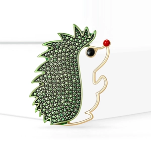 Creative hedgehog brooch in gold alloy with green gradient enamel beads on white stand