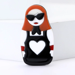 Fashion acrylic doll brooch featuring a red-haired girl with sunglasses on a white base