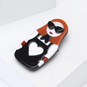 Fashion acrylic brooch featuring a girl with sunglasses and heart pattern on white stand