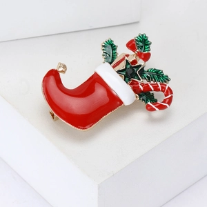 Festive red Christmas stocking brooch with enamel finish and holiday motifs on white base