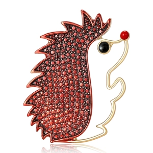 Creative hedgehog brooch with gold metal outline and vibrant red enamel texture detail