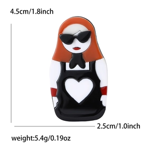 Chic Matryoshka doll brooch with sunglasses and orange hair on white background