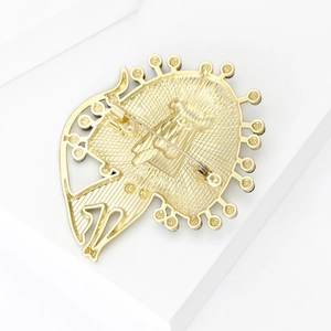 Polished matte gold lion brooch with detailed metal engraving and secure pin back