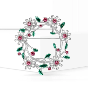 Eleganter silberner Blumenkranz-Brosche mit weißen Kristallen und grünen Emaille-Blättern