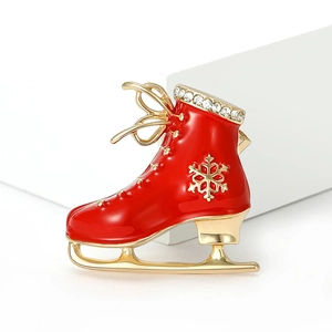 Fashionable red enamel ice skate brooch with sparkling crystals and golden snowflake
